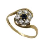 A sapphire and CZ dress ring set in 9ct gold, size P