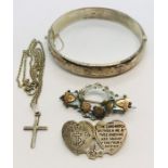 A hallmarked silver hinged bracelet along with two silver sweetheart brooches and a silver cross