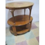 An oak Art Deco oval coffee table along with one other