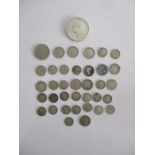 A collection of silver coins and others