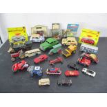 A collection of die cast and other vehicles including a Mettoy clockwork car, Dinky etc.