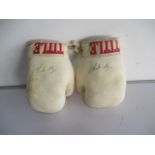 A pair of boxing gloves signed by British former professional boxer Charlie Magri - both gloves