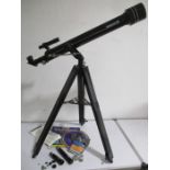 A Tasco telescope with parts and accessories - serial number 302058