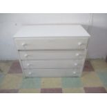 A white painted chest of four drawers