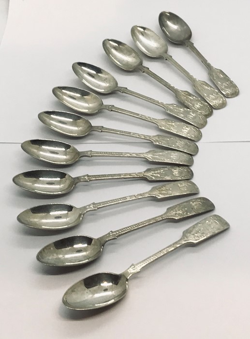 A set of eleven silver coffee spoons, 163.7g