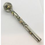 A Chinese silver parasol handle decorated in enamel with floral design