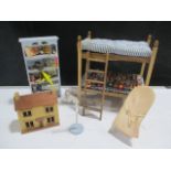 A collection of nursery related dolls house items including bunk beds, shelves containing toys,