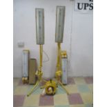 A pair of floor standing work lamps (110 volts), along with two others, a cable reel and spare