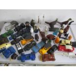 A collection of novelty Avon perfume bottles, which includes bottles in the form of vehicles, pipes,