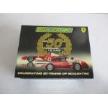 A boxed Scalextric limited edition "Celebrating 50 Years Of Scalexric" set which included two cars