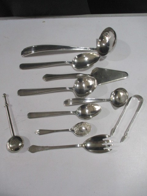 A collection of continental silver plated cutlery (marked 90) along with a pair of silver sugar nips