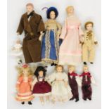 A collection of dolls house figures, some in period style costumes.