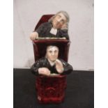 A Staffordshire figure group "Sleeping Judge and Clerk"