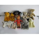 A collection of various vintage teddies, puppets etc