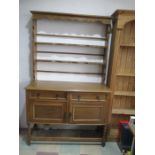 A light oak dresser with open shelves