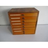 A vintage wooden set of eight drawers