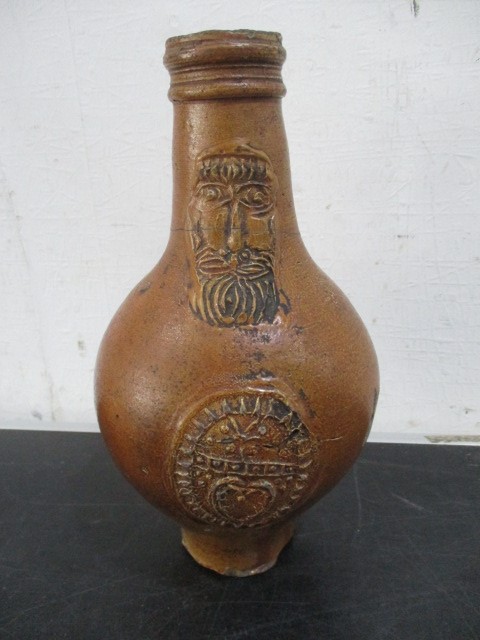 A 17th/18th century Bellarmine jug with bearded mask over armorial- neck repaired- approx 23cm - Image 2 of 15