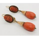 A pair of Victorian coral drop earrings with cameo style upper segments in unmarked gold