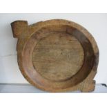 A round wooden dish with two handles, diameter including handles 62cm