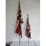 Two vintage union jack flags on poles