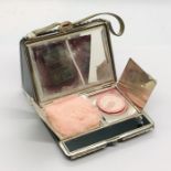 A novelty compact cigarette case in the form of a handbag by Burlington
