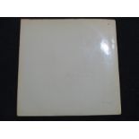The White Album by The Beatles. Double 12" LP - numbered 0057348