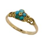 An unmarked gold ring set with a cluster of turquoise, size O