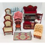 A collection of dolls house chairs, settees etc