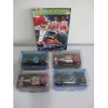 A collection of four cased Scalextric cars including Lewis Hamilton McLaren No 22 (C2865), Lewis