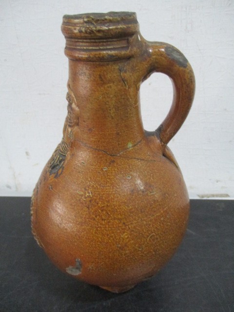 A 17th/18th century Bellarmine jug with bearded mask over armorial- neck repaired- approx 23cm - Image 7 of 15