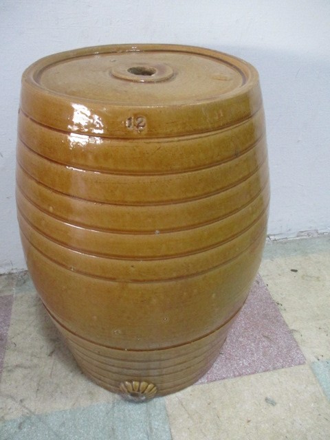 A "honey" glazed pottery barrel by F Melsom, Bristol, height 56cm