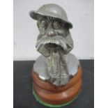 A Bruce Bairnsfather "Old Bill" white metal car mascot mounted on original radiator cap and plinth