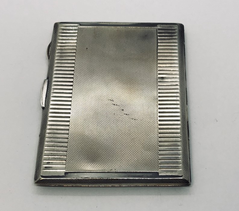 A hallmarked silver cigarette case. Weight 176g - Image 2 of 3
