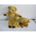 Two vintage jointed teddy bears and a tiger