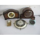 A collection of five clocks, including a Smiths mantle clock, Bentina mantle clock, travel clock,