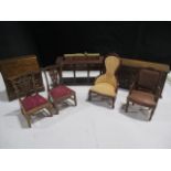 A collection of dolls house furniture including dresser bases, Georgian style bureau, various chairs