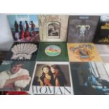 A collection of 12" vinyl records including The Eagles, Frank Sinatra, Dionna Warwick, Carly