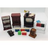 A collection of dolls house items to include vintage radio and TV along with gramophone, magazine
