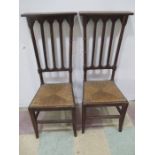 A pair of Victorian oak Gothic Prie Dieu chairs with rush seats