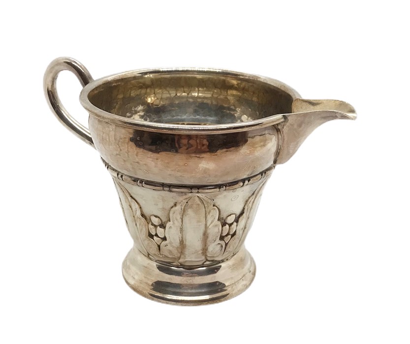 An Arts and Crafts silver plated coffee pot, sugar bowl, and cream jug with hammered detailing, - Image 2 of 4