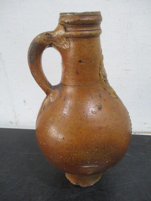 A 17th/18th century Bellarmine jug with bearded mask over armorial- neck repaired- approx 23cm - Image 4 of 15