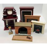 A collection of dolls house fireplaces