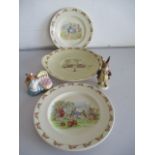 Three Royal Doulton Bunnykins plates along with a Beswick Mr Benjamin Bunny and Hunca Munca