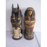 Two CD holders, one in the form of an Egyptian mummy, the other as Anubis