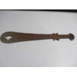 A hand held "Sword" style paddle with hand worked decoration- possibly tribal