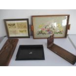 An assortment of items including a wooden biscuit mould, wooden tray with flower embroidery,