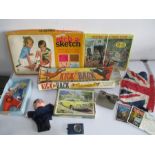 A collection of vintage toys, games and jigsaw puzzles including Kick Back, Etch-a-Sketch, View-