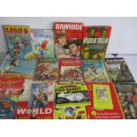 A quantity of vintage annuals and books including wild west annuals, Superman, Rupert Bear etc.
