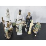 A collection of Oriental figures along with one other
