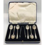 A cased set of hallmarked silver coffee spoons with sugar tongs